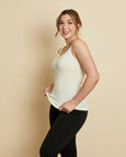 Woman wearing soft Australian Merino wool sleeveless singlet in natural. Designed to wear next to the skin as a base layer, it is perfect for layering. Made in Australian at Woolerina's workrooms at Forbes in central west NSW.