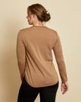 Woman wearing soft Australian Merino wool crew neck pullover in camel. Relaxed fitting, designed to wear over other layers as an outer layer or on its own next to the skin. Made in Australia at Woolerina's workrooms at Forbes in central west NSW.