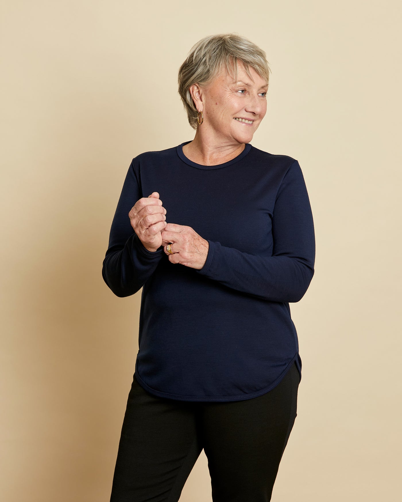 Woman wearing soft Australian Merino wool crew neck pullover in navy. Relaxed fitting, designed to wear over other layers as an outer layer or on its own next to the skin. Made in Australia at Woolerina's workrooms at Forbes in central west NSW.