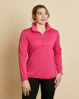 Woman wearing a soft Australian Merino wool pullover with a quarter zip in hot pink. Relaxed fitting, designed to wear over other layers as an outer layer or on its own next to the skin. Made in Australia at Woolerina's workroom at Forbes in central west NSW.