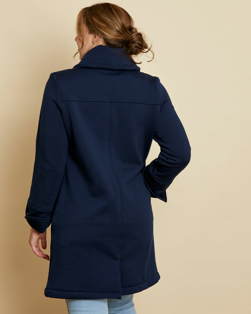 Woman wearing soft Australian Merino wool 3/4 length, full zip jacket in navy. Designed to be worn over other layers, as a coat. This style is perfect for layering. Made in Australia at Woolerina's workrooms at Forbes in central west NSW.