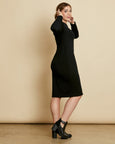 Woman wearing soft Australian Merino wool relaxed fitting long sleeve crew neck dress in black. Designed as a relaxed fit and sitting around knee length. This style is perfect as a base to add other layers. Made in Australia at Woolerina's workrooms at Forbes in central west NSW.
