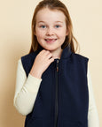 Close up of girl wearing soft Australian Merino wool full zip sleeveless vest in navy. Designed to wear over other layers as an outer layer. Made in Australia at Woolerina's workrooms at Forbes in central west NSW.