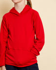 Close up of girl wearing soft Australian Merino wool hoodie in red. Designed to wear over other layers as an outer layer. Made in Australia at Woolerina's workrooms at Forbes in central west NSW.