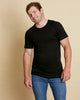 Man wearing soft Australian Merino wool short sleeve crew neck t.shirt in black. Designed to wear next to the skin as a base layer or on its own as a t.shirt style. Made in Australia at Woolerina's workrooms at Forbes in central west NSW.