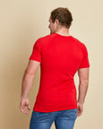 Man wearing soft Australia Merino wool short sleeve crew neck t.shirt. Designed to wear next to the skin as a base layer/thermal or on its own as a t.shirt style in tomato red. Made in Australia at Woolerina's workrooms at Forbes in central west NSW.