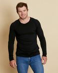Man wearing soft Australian Merino Wool long sleeve t.shirt in black. Designed to be worn next to the skin either as a base layer/thermal style or as a t.shirt on its own. Australian Made at Woolerina's workrooms at Forbes in central west NSW.