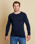 Man wearing soft Australian Merino Wool long sleeve t.shirt in navy. Designed to be worn next to the skin either as a base layer/thermal style or as a t.shirt on its own. Australian Made at Woolerina's workrooms at Forbes in central west NSW.