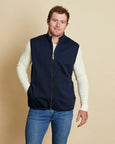 Man wearing a soft Australian Merino wool full zip vest in navy. Designed to wear over other layers as an outer layer. Made in Australia at Woolerina's workrooms at Forbes in central west NSW.
