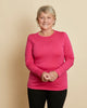 Woman wearing soft Australian Merino wool long sleeve crew neck in hot pink. Designed to wear next to the skin either as a base layer or as a t.shirt style on its own. This style is perfect for layering. Made in Australia at Woolerina's workrooms at Forbes in central west NSW.