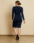 Woman wearing soft Australian Merino wool long sleeve scoop neck, knee length dress in navy. A slim fitting style, it is perfect for layering! Made in Australia at Woolerina workrooms at Forbes in central west NSW.