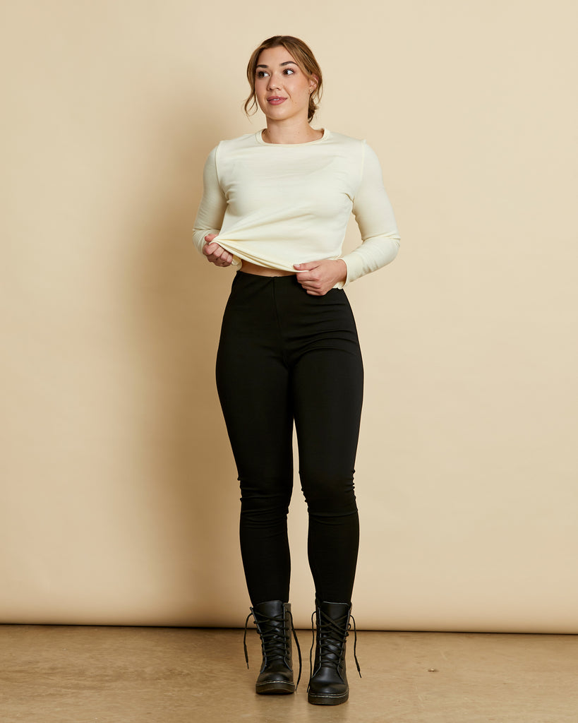 Woman wearing soft Australian Merino wool ponte pant in black. Slim fitting, with a straight leg and elastic waist. Made in Australia at Woolerina's workrooms at Forbes in central west NSW.