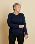 Woman wearing soft Australian Merino wool crew neck pullover in navy. Relaxed fitting, designed to wear over other layers as an outer layer or on its own next to the skin. Made in Australia at Woolerina's workrooms at Forbes in central west NSW.
