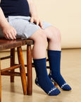 Child wearing Australian merino wool socks made by Humphrey Law in Melbourne VIC.